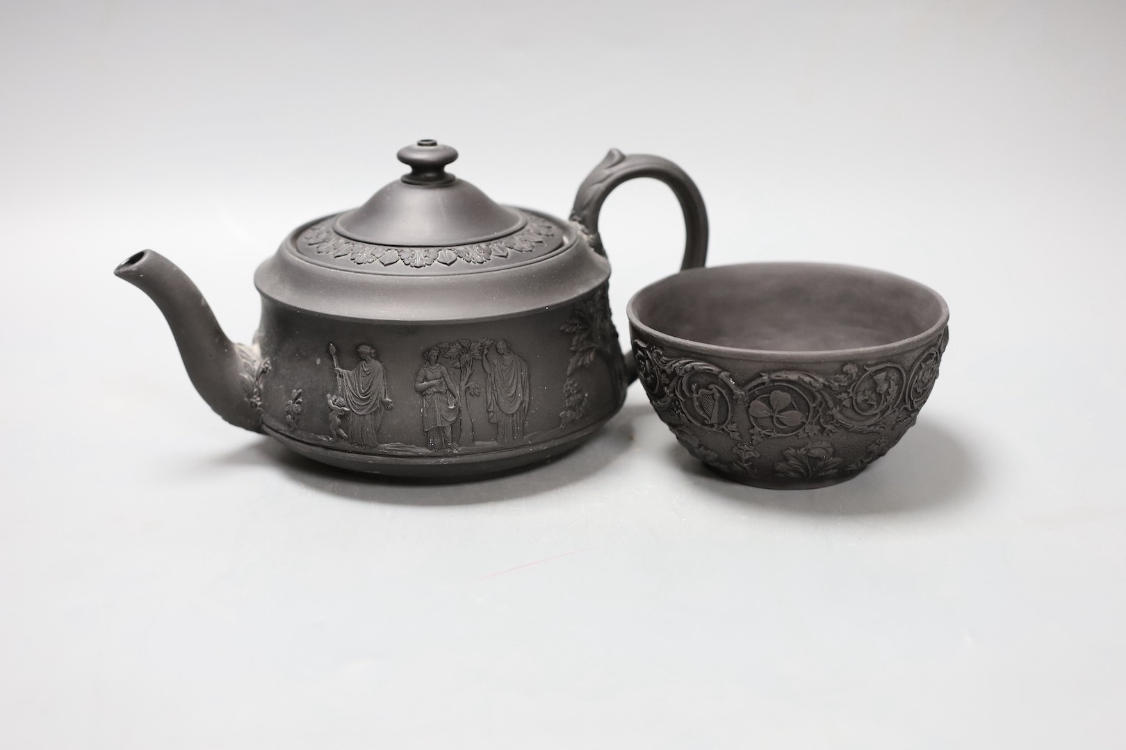 A Wedgwood black basalt 'Union' sugar bowl, early 19th century and a teapot and cover 10cm tall